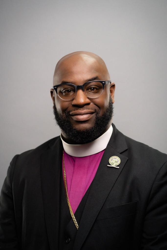 Bishop Owens in formal suit and collar