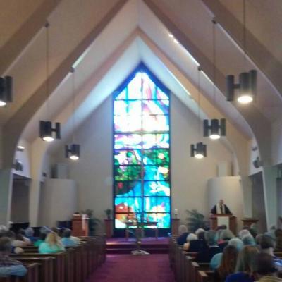 Our beautiful stained glass window accentuates our worship of God the Creator, Son, and Holy Spirit