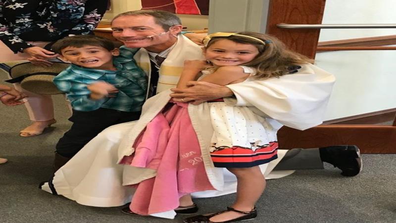 Pastor Harold visiting with some children of NCUMC.