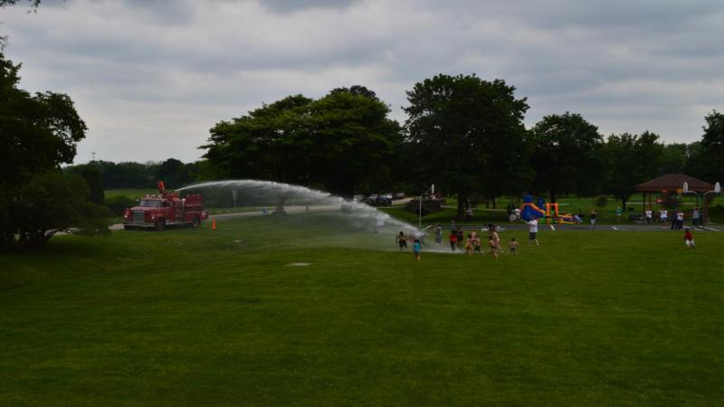 Soaking kids with water at the Father's Day Cookout