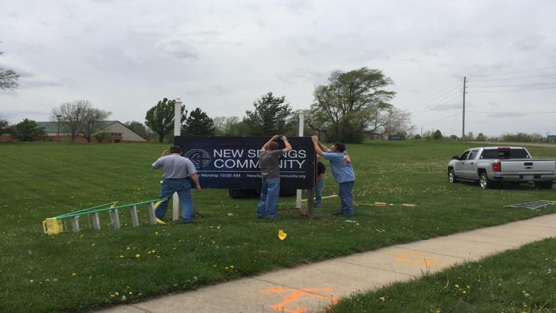 Putting up the new NSC sign
