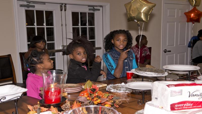 Children enjoying Thanksgiving at Divine Faith Ministry