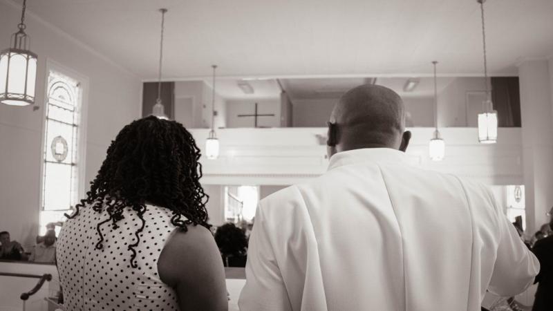 Pastor and First Lady Carmichael greeting the congregation together!